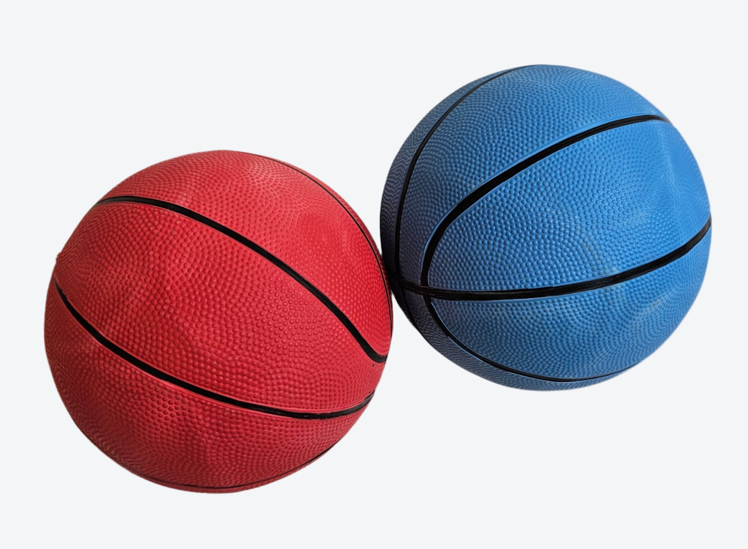 Two inflatable mini basketballs in red and blue colors with a black hoop design, designed for children's play.