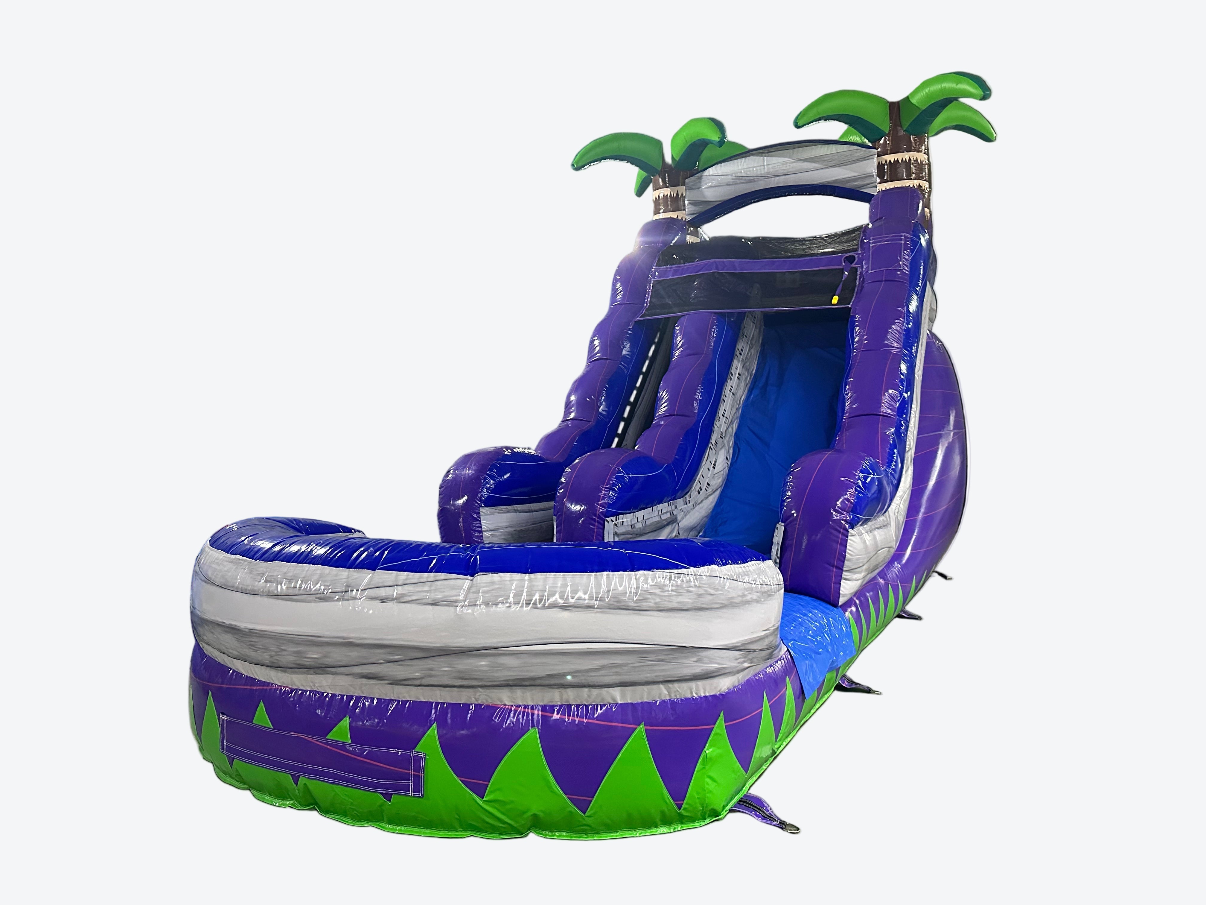 Inflatable water slide with purple and green palm tree design