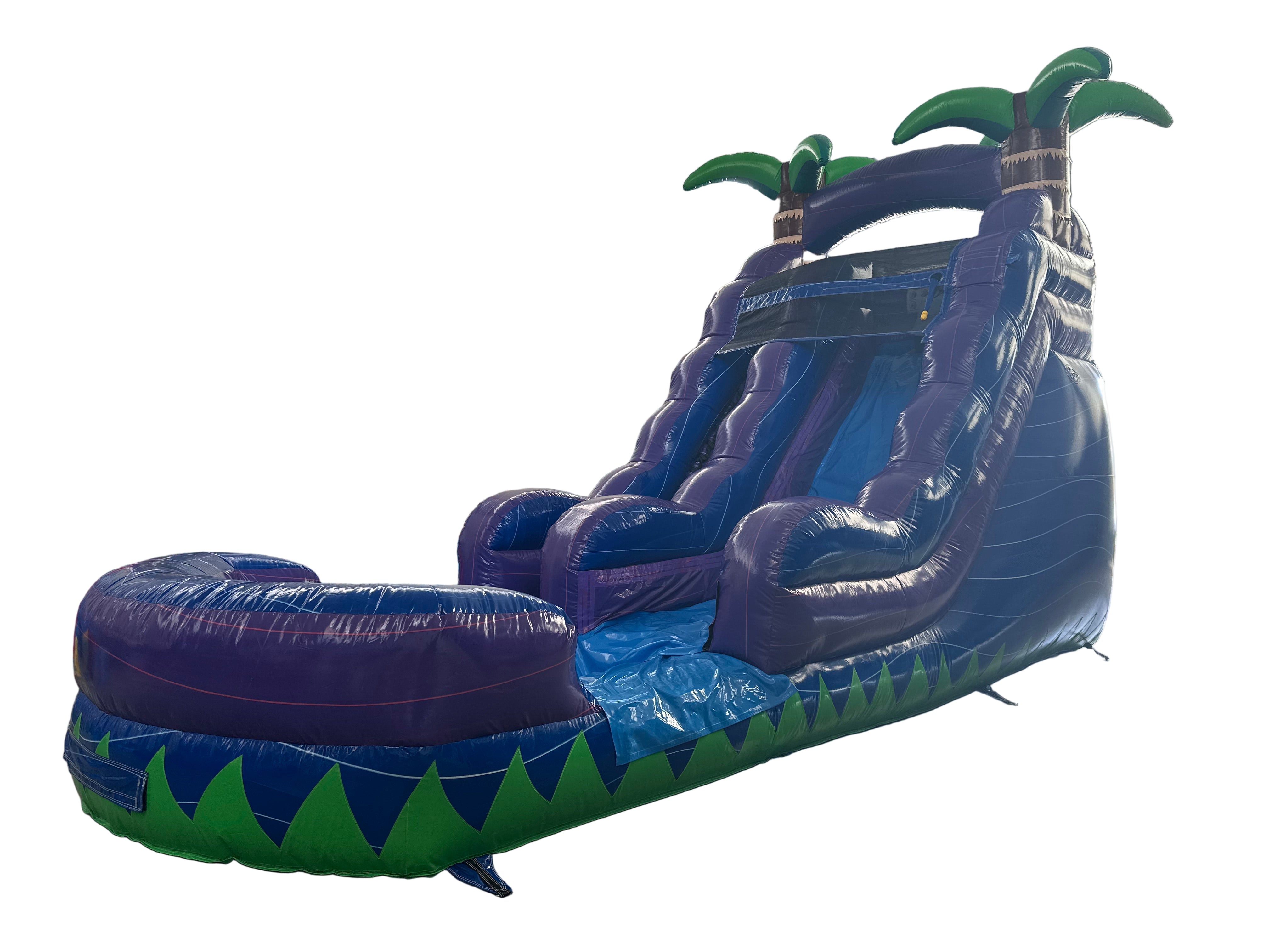 Inflatable water slide with palm tree design in an indoor setting